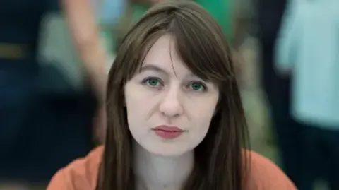 Sally Rooney claims she cannot visit the UK over potential arrest